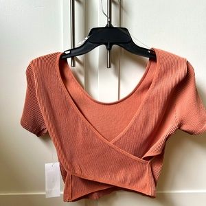 BRAND NEW: peachy pink, sweet-heart, soft to the touch crop top.      SIZE: M/L